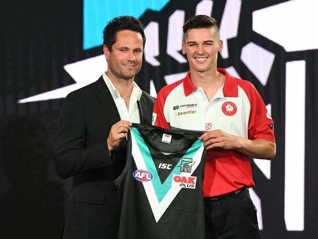 Number 5 pick Connor Rozee (right) is seen during the 2018 AFL Draft at Marvel Stadium in Melbourne, Thursday, November 22, 2018. (AAP Image/James Ross) NO ARCHIVING