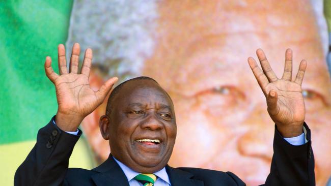 (FILES) This file photo taken on February 11, 2018 shows  South African Deputy President and newly-elected president of the ruling African National Congress (ANC) Cyril Ramaphosa reacting during a rally on February 11, 2018 in Cape Town.  Cyril Ramaphosa's long and eventful career has taken him from trade union activist to multi-millionaire -- and now within a heartbeat of the South African presidency.  / AFP PHOTO / RODGER BOSCH