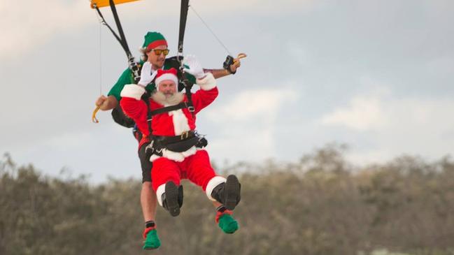 CHRISTMAS: Santa makes an impressive entrance at the 2018 carols.