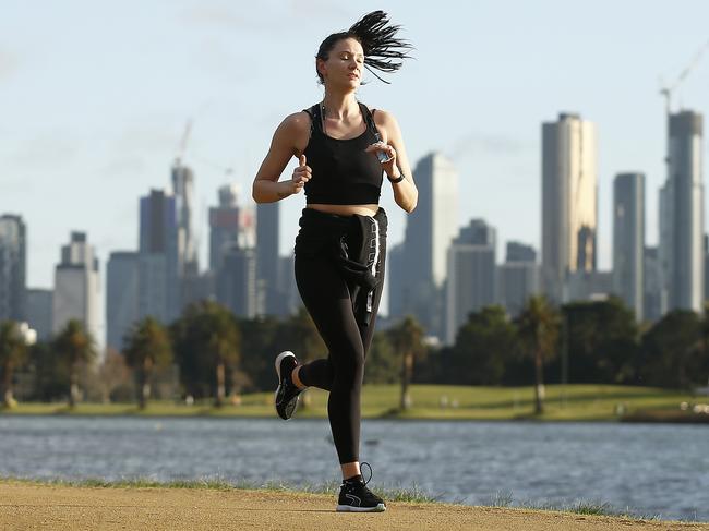 People are seen exercising at Albert Park Lake in Melbourne. Picture: Getty