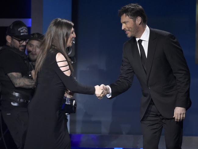 Mayim Bialik, accepts the award from Harry Connick Jr. for best supporting actress in a comedy series for “The Big Bang Theory” at the 23rd annual Critics’ Choice Awards at the Barker Hangar on Thursday, Jan. 11, 2018, in Santa Monica, California. Picture: AP