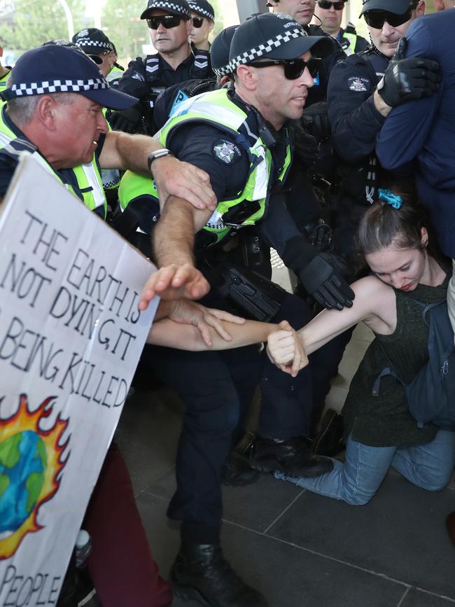 Protesters attempt to stop delegates entering the conference centre. Picture: AAP.