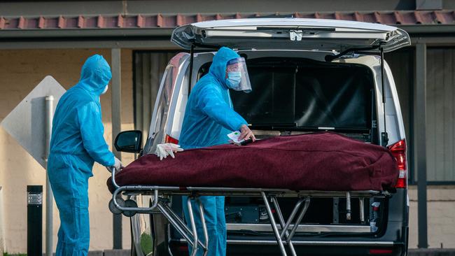 A body is brought out from the nursing home. Picture: Jason Edwards