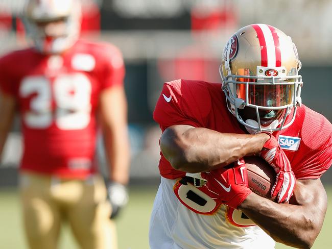 Reggie Bush during 49ers practice with Jarryd Hayne looking on.