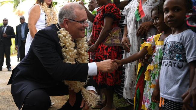 Australian Prime Minister Scott Morrison greets locals during a visit to the National Archives and Library in Port Vila, Vanuatu. Picture: AAP