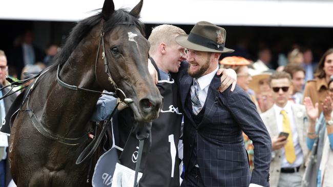 Ciaron Maher gets a hug from Gold Trip’s strapper. Picture: David Caird