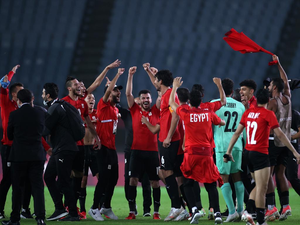 Players of Team Egypt celebrate after victory in the Men's Group C match against Australia.