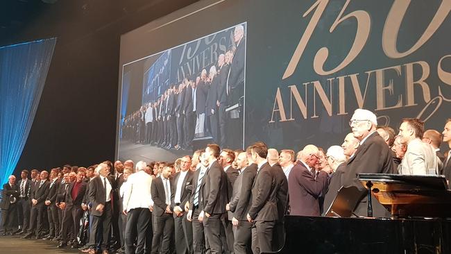 Past and present players on stage at the Port Adelaide 150th anniversary gala. Picture: Matt Turner – Twitter.