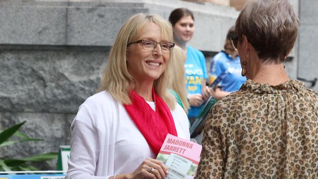 Labor's Madonna Jarrett handing out how to vote cards at City Hall pre-polling centre, Brisbane. Picture: Liam Kidston