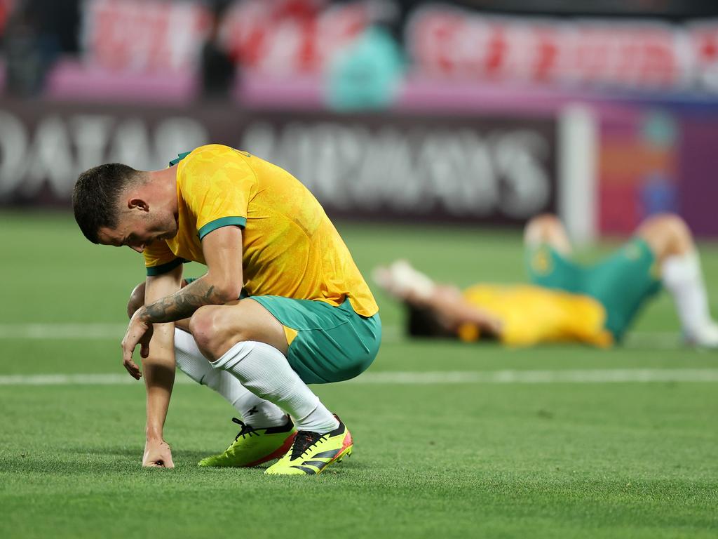 DOHA, QATAR - APRIL 18: Jordan Courtney-Perkins of Australia reacts after losing against Indonesia during the AFC U23 Asian Cup Group A match between Indonesia and Australia at Abdullah Bin Khalifa Stadium on April 18, 2024 in Doha, Qatar.(Photo by Mohamed Farag/Getty Images)