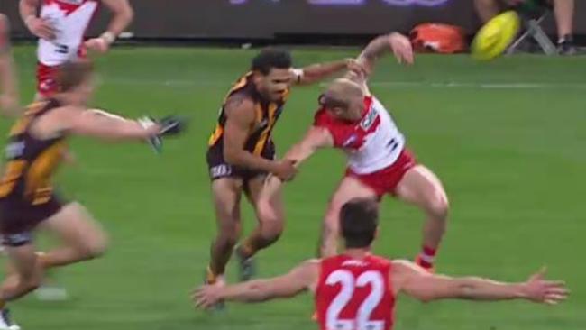 Cyril Rioli tackles Zak Jones by the arms.