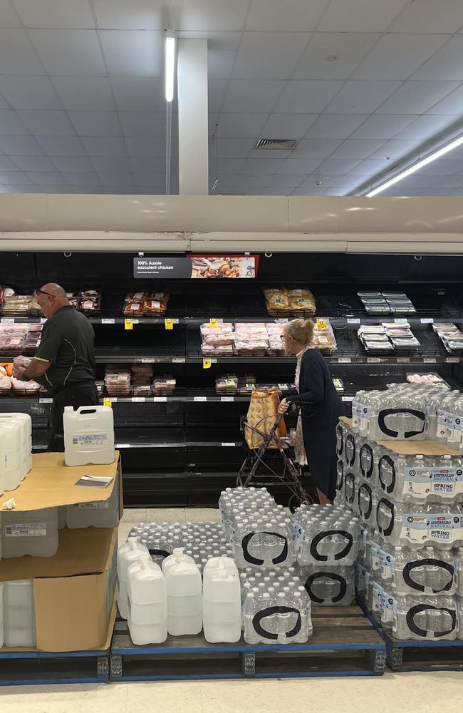 Essential stock such as water stacked up, Mackay Sydney Street Coles, February 5, 2025