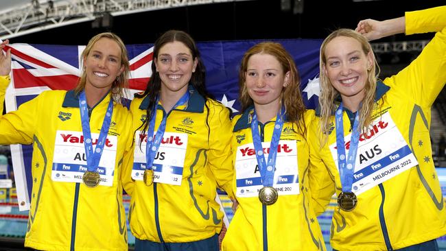 MELBOURNE, AUSTRALIA - DECEMBER 13: (L-R) Gold medallists Emma McKeon, Meg Harris, Mollie O'Callaghan and Madison Wilson of Australia pose during the medal ceremony for the WomenÃ¢â¬â¢s 4x100m Freestyle Final on day one of the 2022 FINA World Short Course Swimming Championships at Melbourne Sports and Aquatic Centre on December 13, 2022 in Melbourne, Australia. (Photo by Daniel Pockett/Getty Images)