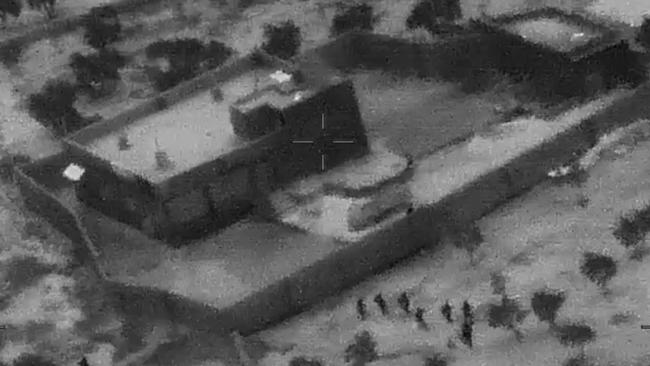 U.S. Special Forces, figures at lower right, move toward the compound of Islamic State leader Abu Bakr al-Baghdadi on October 26.