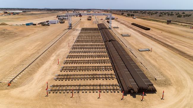 Looking lengthwise down the flash butt welding yard, with stacked rail on the right and gantry in the distance. Picture: Cameron Laird