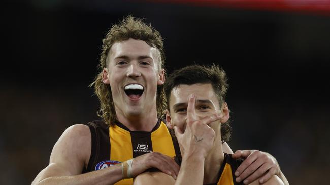 MELBOURNE, AUSTRALIAÃ&#137; June 15, 2024. AFL Round 14. Richmond vs Hawthorn at the MCG. Connor Macdonald of the Hawks celebrates a 2nd quarter goal with Josh Weddle . Pic: Michael Klein