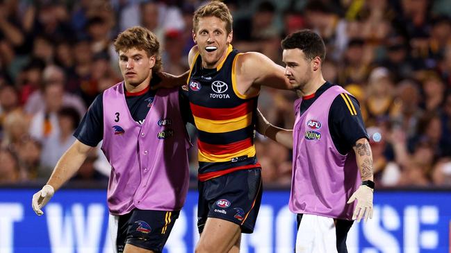 Rory Sloane is helped from the field after injuring his knee. Picture: AFL Photos via Getty Images