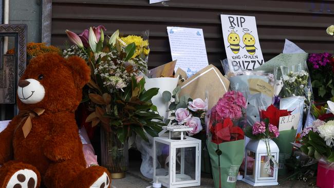 Tributes in front of the shop. Picture: Jonathan Ng