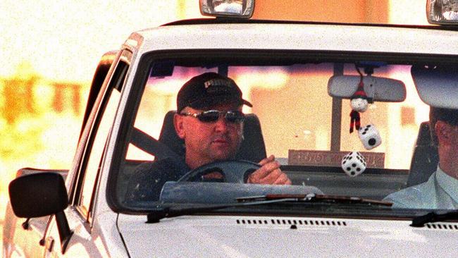 Vincent Latorre driving into the yard of the Shepparton Police Station to be questioned about the murder of Rocky Iaria in 1999.