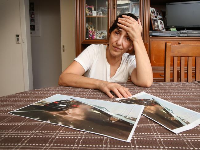 Nella Lettieri looks at photos from the crash with the overhead sign. Picture: David Caird