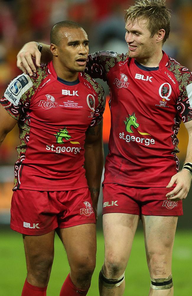 Will Genia and Ben Lucas celebrate the Reds’ win.