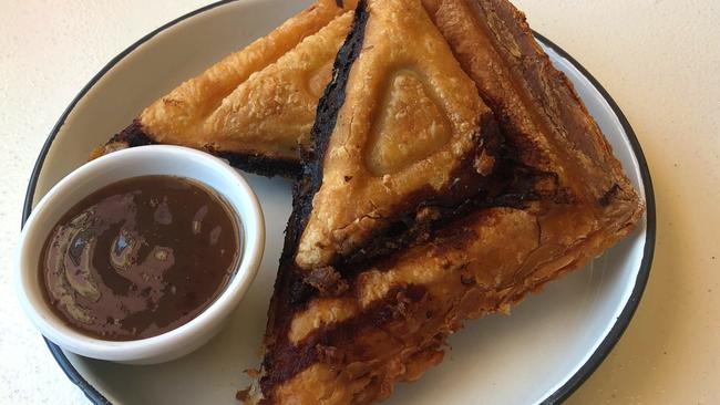 The beef cheek and cheese jaffle with sarsaparilla and plum sauce.