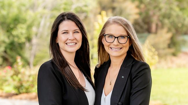 Danielle Comer (left) with Rachael Farror of Magain Real Estate.