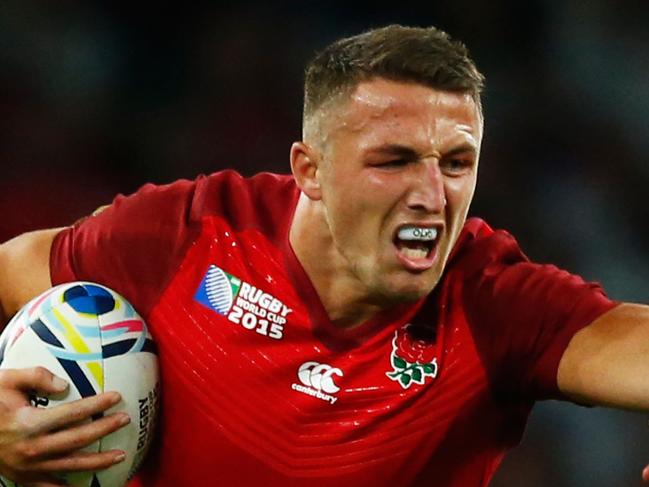 LONDON, ENGLAND - SEPTEMBER 18: Sam Burgess of England hands off Tuapati Talemaitoga of Fiji during the 2015 Rugby World Cup Pool A match between England and Fiji at Twickenham Stadium on September 18, 2015 in London, United Kingdom. (Photo by Shaun Botterill/Getty Images)