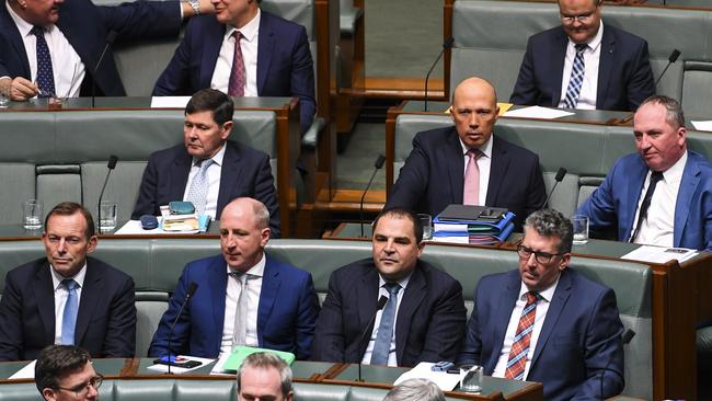 Former Home Affairs Minister Peter Dutton and former PM Tony Abbott, along with former deputy PM Barnaby Joyce, take their place as backbenchers. (Pic: Lukas Coch/AAP)