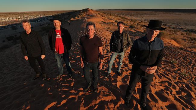 From left, Martin Rotsey, Jim Moginie, Rob Hirst, Bones Hillman and Peter Garrett on the Big Red sand dune near Birdsville yesterday. Picture: Lyndon Mechielsen