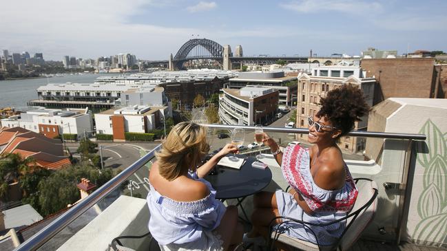 Mahalia Lloyd and Monica Kim toast life at the Palisade. Picture: Tim Pascoe