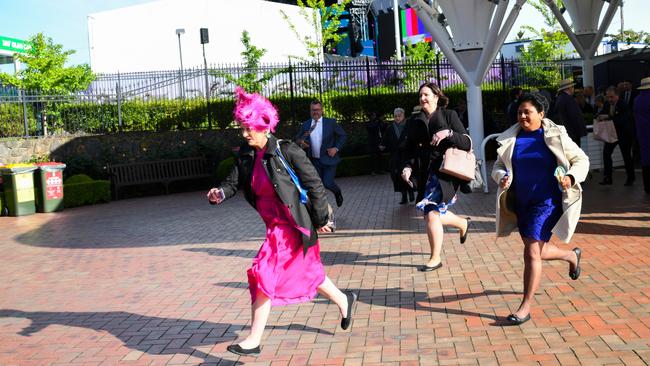 Racegoers arrive at the 2022 Lexus Melbourne Cup Day.