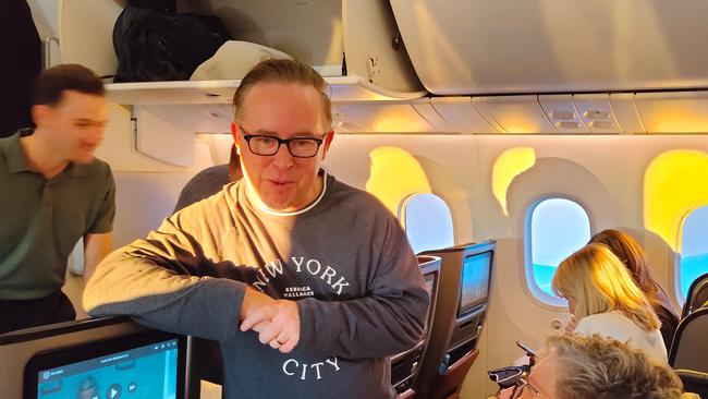 Qantas chief executive Alan Joyce talking with passengers. Picture: David Williams/AFP