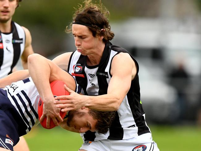 James Sekulovski of Bundoora is tackled during the round 13 Northern Football Netball League 2023 Melbourne Greyhounds Division 1 Seniors match between Bundoora and Montmorency at Yulong Reserve in Bundoora, Victoria on July 15, 2023. (Photo by Josh Chadwick)