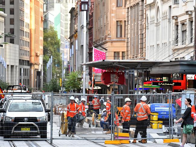 Light rail workers still completing the project more than three years since work began. Picture: AAP Image/Mick Tsikas