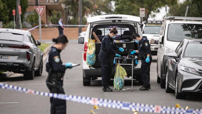 Police Forensic officers in Crossland Street in Merrylands following a shooting. Picture: Julian Andrews
