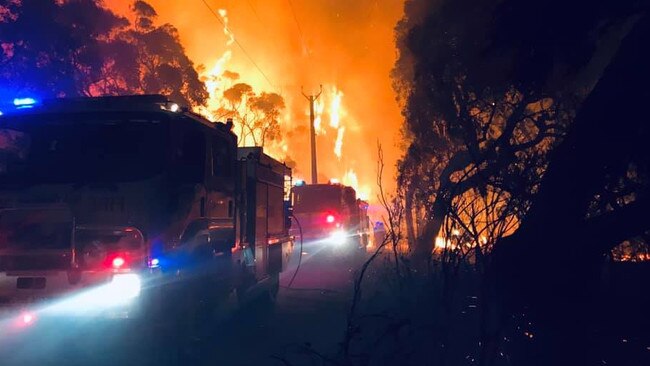 CFS trucks move through the Cherry Gardens fire at its peak. Picture: Salisbury Country Fire Service