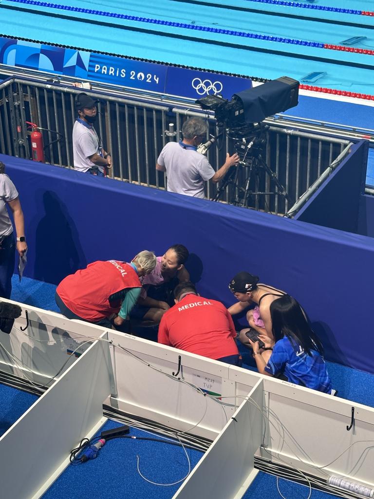 Ikee appeared to collapse on pool deck in Paris.