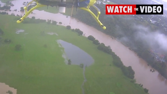 Five people and dog rescued from home cut off by floodwaters