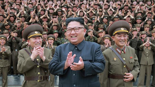 Will Kim Jong-un and his generals part with their weapons? Picture: KCNA/AFP