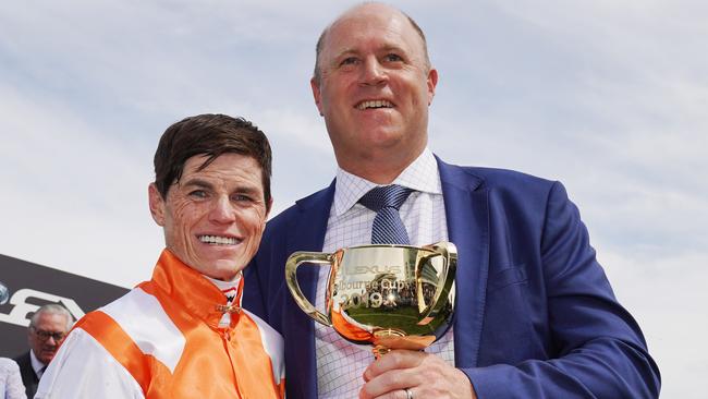 Jockey Craig Williams and trainer Danny OÕBrien pose with the trophy after winning with Vow And Declare to victory in race 7, the Lexus Melbourne Cup, during Melbourne Cup the Lexus Melbourne Day, at Flemington Racecourse in Melbourne, Tuesday, November 5, 2019. (AAP Image/Michael Dodge) NO ARCHIVING, EDITORIAL USE ONLY