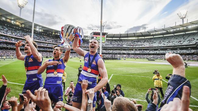 Bulldogs Tom Liberatore, Luke Dahlhaus and Jake Stringer celebrate their incredible premiership. Picture: Jason Edwards