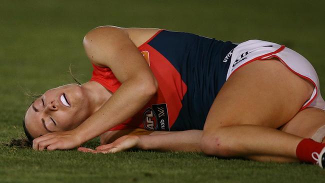 Meg Downie was taken off on a stretcher in a neck brace. Picture: Wayne Ludbey