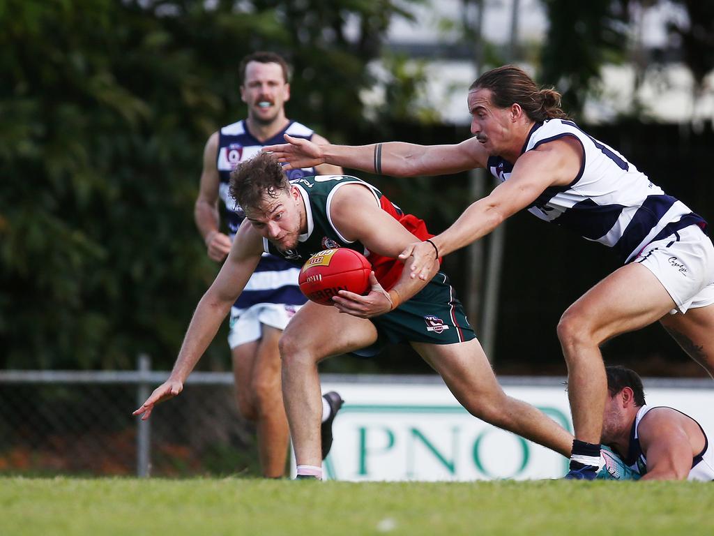 Cutters' Josh Barnett gets away from three Crocs defenders in the AFL Cairns Premiership men's match between the South Cairns Cutters and the Port Douglas Crocs, held at Fretwell Park, Bentley Park. Picture: Brendan Radke