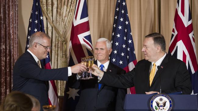 Mr Morrison shares a toast with US Secretary of State Mike Pompeo, right, and Vice President Mike Pence, during a luncheon at the State Department on Friday.