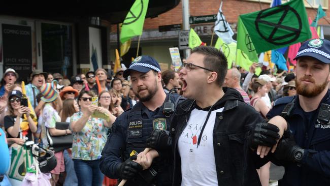 Protesters are removed and arrested during an Extinction Rebellion protest on Monday. Picture: AAP/Jeremy Piper