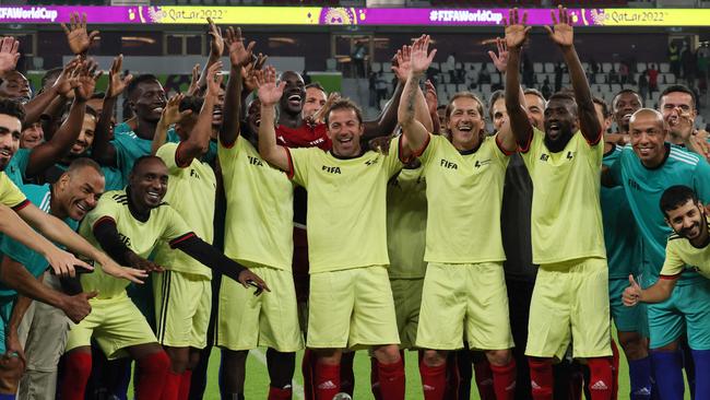 FIFA organised a game between football legends and Qatar-based workers during the World Cup. (Photo by KARIM JAAFAR / AFP)