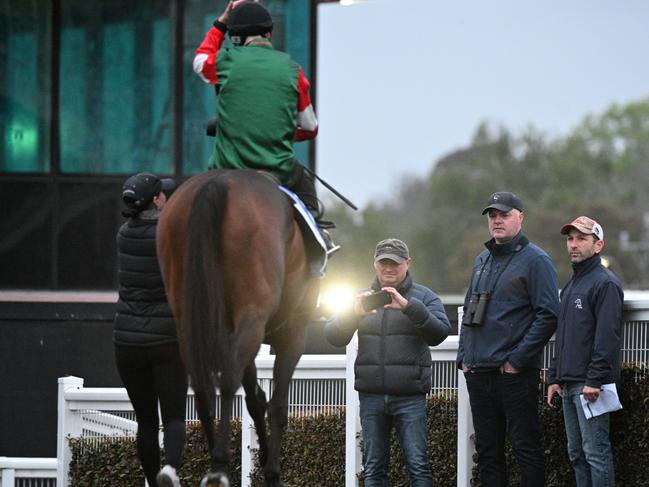 MELBOURNE, AUSTRALIA - OCTOBER 10: Trainer Simon Miller looks on as Damian Lane riding Amelia's Jewel returns after a trackwork session at Caulfield Racecourse on October 10, 2023 in Melbourne, Australia. (Photo by Vince Caligiuri/Getty Images)