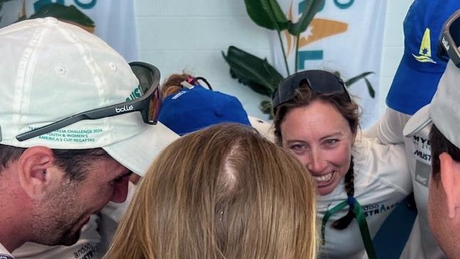 Olivia Price in a huddle after being beaten for a spot in the semi-finals.