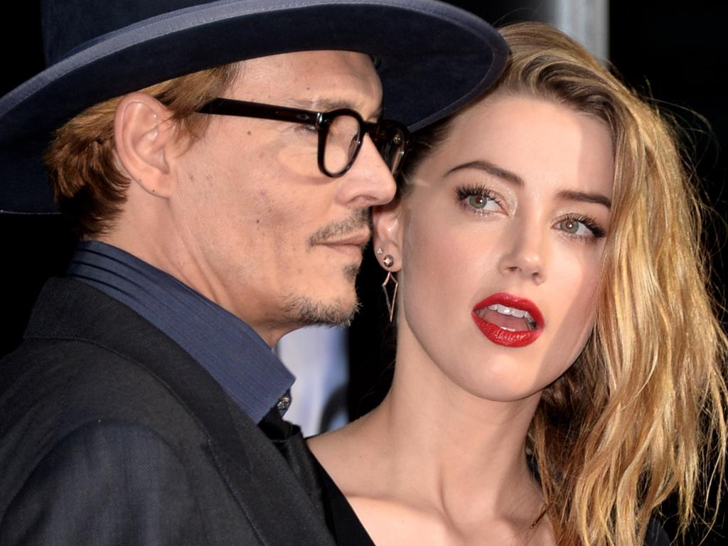 Johnny Depp and his then fiance, Amber Heard at the premiere of “3 Days To Kill” in Los Angeles, California on February 12, 2014. Picture: Kevin Winter/Getty Images.